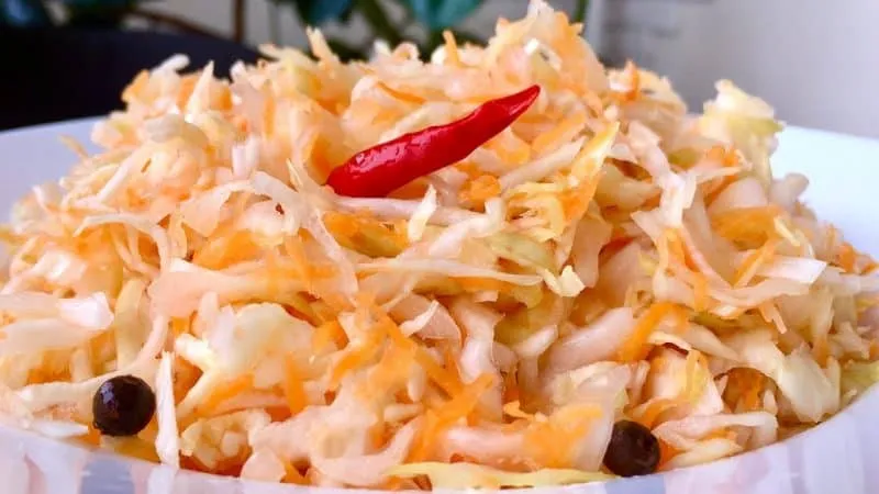 Guide on how to properly salt cabbage for winter in a pot with various ingredients